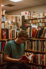 young male student in the library