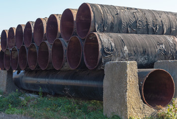 Images of natural gas transportation equipment, including large diameter and high pressure pipes,...