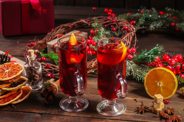 Fototapeta na wymiar Christmas mulled wine on a wooden table. Traditional hot drink at Christmas (red wine with spices, New Year's Eve, Noel holiday festive) x-mas flat lay. food background. copy space. Top viev