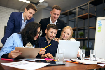 Fototapeta premium young ambitious business people sharing ideas, plans of new project, close up photo.teamwork