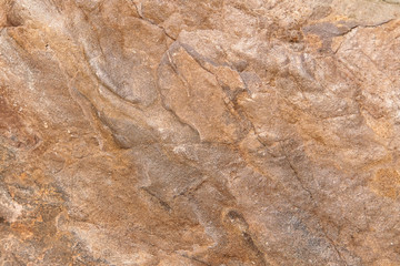 seamless background texture of natural raw stone brown granite