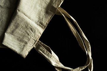Fototapeta na wymiar White tote bag mockup canvas fabric cloth eco shopping sack blank template isolated on blackboard background natural