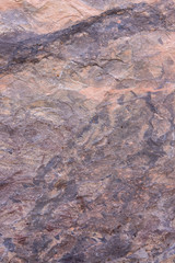 seamless background texture of natural raw stone brown granite