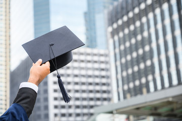 Close up Graduation holding graduation cap education concept