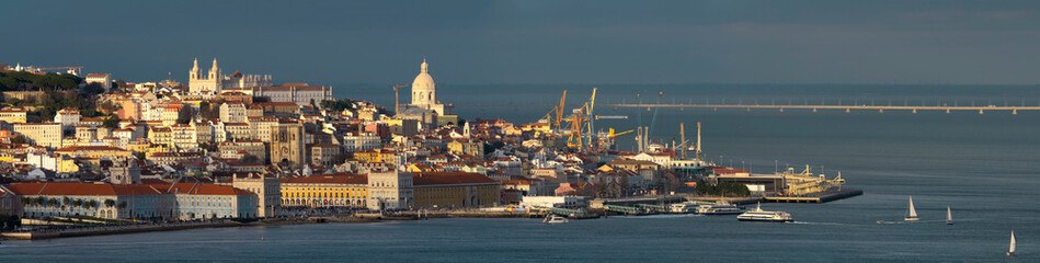 Fototapeta na wymiar Aerial panorama of Lisbon old city center at sunset, view from Almada, Portugal