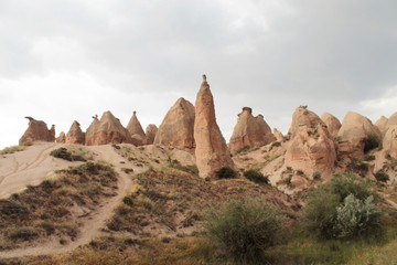 Fototapeta premium Cappadocia landscape. Countryside scenery. Paths to the rocky hills