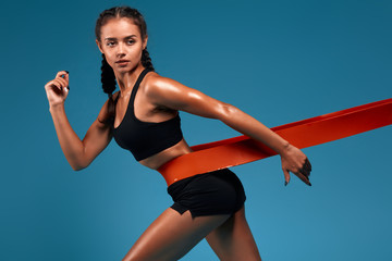 beautiful awesome athlete girl keeps fit, leads healthy lifestyle. close up side view photo....