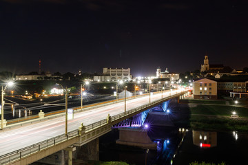Embankment, the Neman River and the Old Bridge in Grodno. Night view of the city and the Old Bridge