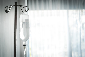 saline solution hanging on steel pole in hostital