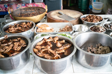 Chinese stewed duck in pot with various duck sauce