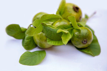 Fresh guava with leaf isolated on white background.