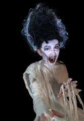 studio shot portrait of young girl in costume dressed as a Halloween, cosplay of scary bride of...