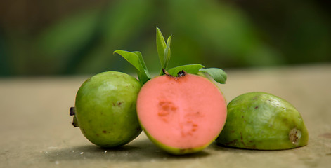 Red Guava fruit with leaves isolated on the nature background.