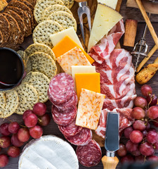 Assorted cheese and crackers.