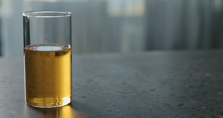 pear cider in glass on terrazzo countertop with copy space