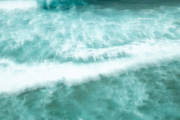 Fototapeta na wymiar Sea water wave, abstract motion, long exposure, turquoise, blurred texture, background