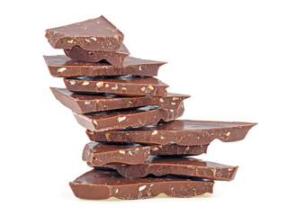 Delicious milk chocolate isolated on white background. Chocolate bars with chopped nuts.