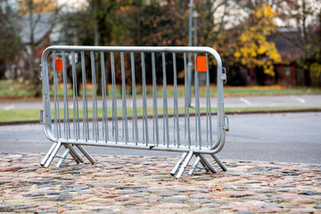 Barrier, metal fence for security for holding off people and transport
