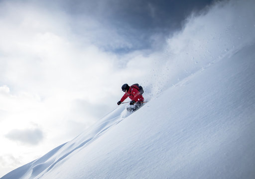 Man Skiing in deep powder snow in the Austrian Alps, Zauchensee, Salzburg, Austria