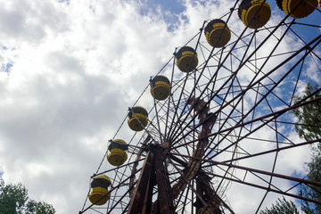 Abandoned amusement park. ferris wheel in an amusement park in Pripyat. Unhappy childhood.