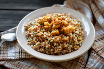 Buckwheat with meat in a plate. Russian food, vegan food concept.