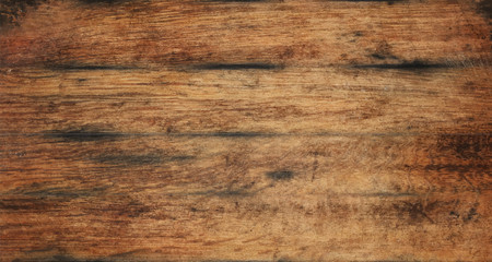 Naklejka premium Old aged brown wooden planks background texture
