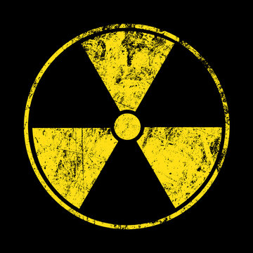 Yellow radioactive sign over black background