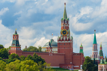 Fototapeta premium Moscow. Russia. Kremlin on a summer day. Spasskaya tower of the Kremlin with a star and chimes. Symbol of the capital of the Russian Federation. Architecture of Moscow.