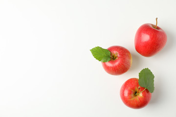 Flat lay with red apples on white background, space for text
