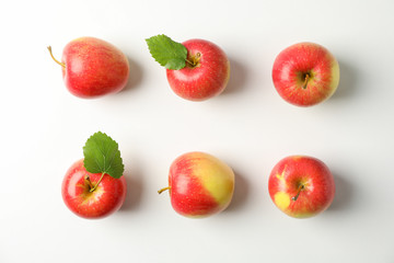Flat lay with red apples on white background, space for text