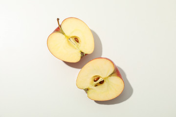 Halves of apple on white background, space for text