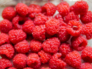 Red fresh juicy raspberry, Close up. Selective focus, Concept fresh fruit, healthy eating, organic produce.