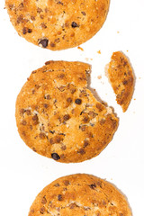 conceptual photo. chocolate chip oatmeal cookies on white background, vertical top view