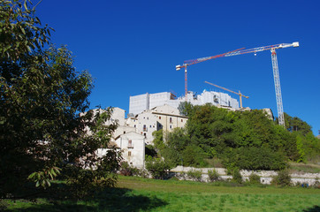 Reconstruction of the post-earthquake in Santo Stefano di Sessanio, L'Aquila, Abruzzo, Italy. You see the cranes that work