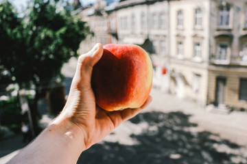 peach in hand