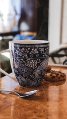 cup of coffee with cookies