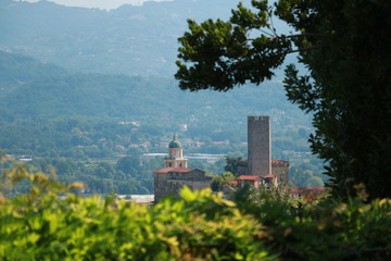 Village of Arcola with the pentagonal tower and in the background the valley of the Magra river and the Apuan Alps.