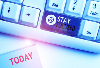 Word writing text Stay Focused. Business photo showcasing Be attentive Concentrate Prioritize the task Avoid distractions White pc keyboard with empty note paper above white background key copy space