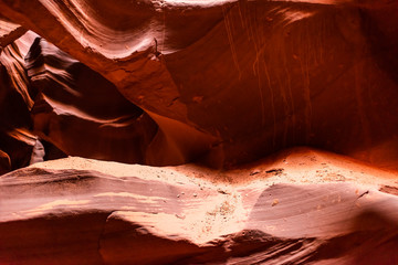 Abstract closeup view of sand on rocks with shadows and light at upper Antelope slot canyon...