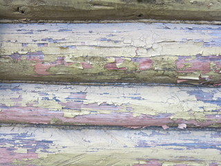 round logs with peeling paint