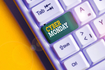 Conceptual hand writing showing Cyber Monday. Concept meaning Marketing term for Monday after thanksgiving holiday in the US White pc keyboard with note paper above the white background