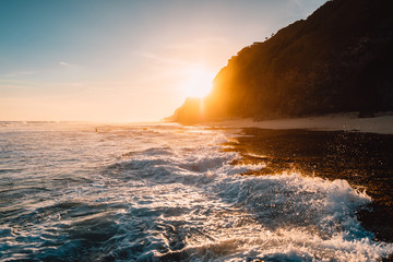 Tropical beach with ocean, waves and sunshine