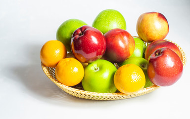 fresh fruit, in a straw basket, apples, tangerines