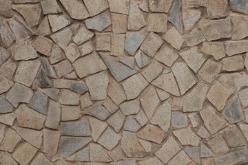 Paving slabs of irregular shape and different sizes.