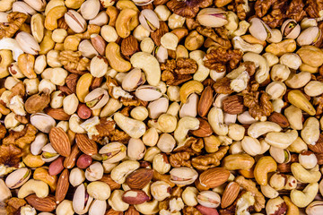 Background of the various nuts (almond, cashew, hazelnut, pistachio, walnut). Vegetarian meal. Healthy eating concept