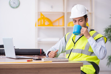 Young male architect working in the office