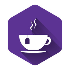 White Cup with tea bag icon isolated with long shadow. Purple hexagon button. Vector Illustration