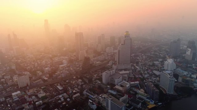 4K aerial drone footage of Bangkok skyline, Great sunset scene. Business city, view of Bangkok downtown, Flying over Bangkok, Thailand.