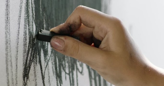 elegant female hand of artist Drawing with charcoal, prores4444, RAW, Arri Alexa mini, 50fps