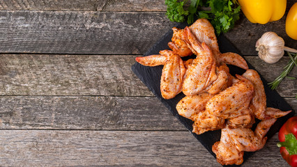 Raw marinated chicken wings ready to cook. Copy space. Top view